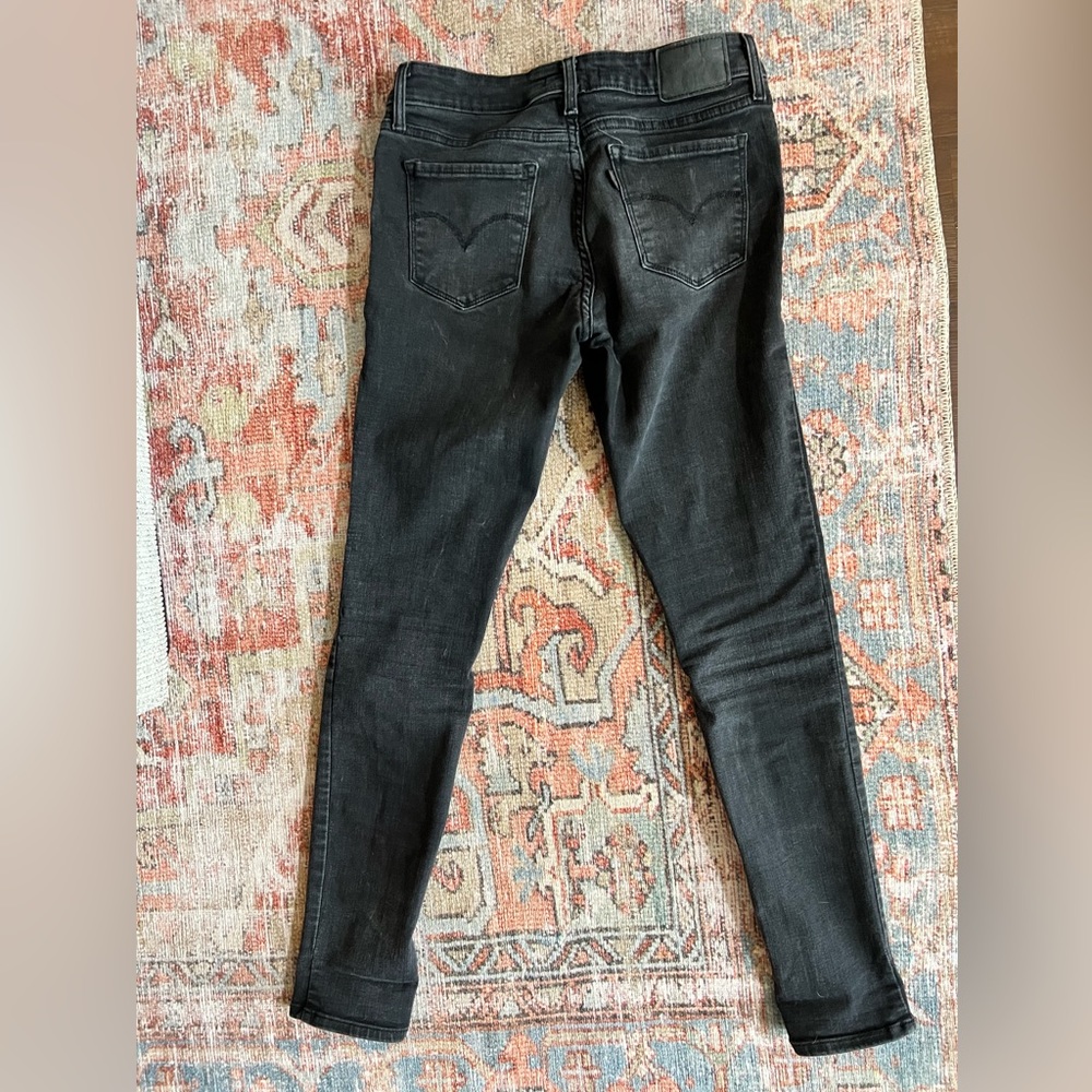 711 distressed black jeans